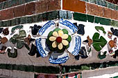 Bangkok Wat Arun - polychromatic mosaic flowers made from discarded ceramic pottery cut into petal shape. 